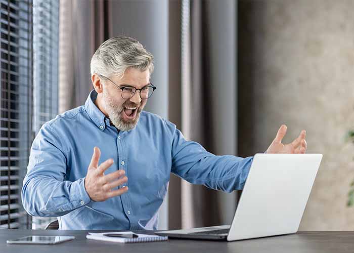 Slow laptop speed performance man angry